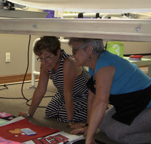 Susan and Chris laying out a quilt design